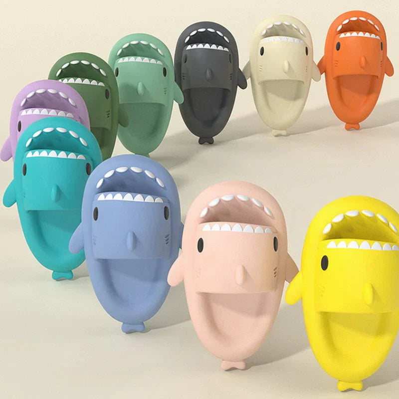 Colorful shark-shaped slippers on a light background